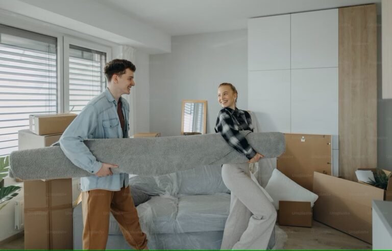 Young Canadian couple reviewing RRSP documents while planning their first home purchase under the Home Buyers’ Plan.