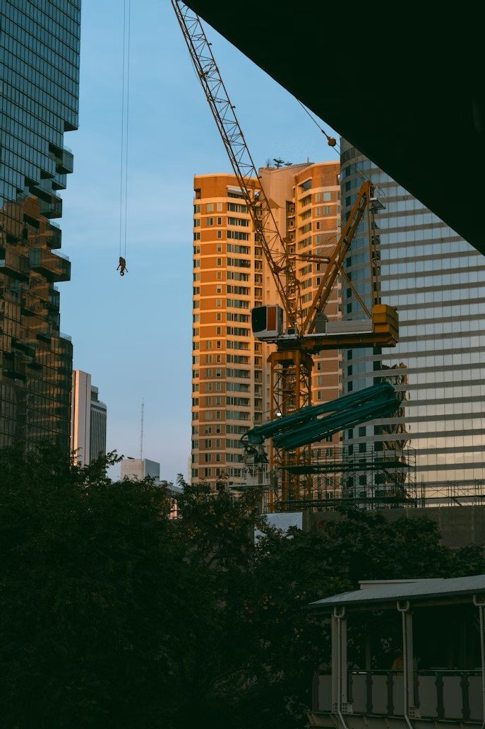 “Vancouver skyline with active housing construction cranes in June 2025”