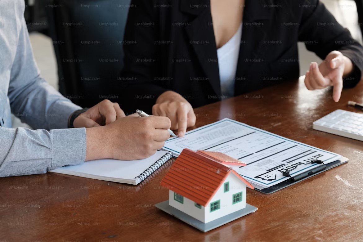 Canadian homeowner holding two mortgage term sheets labeled 3-Year and 5-Year fixed rates