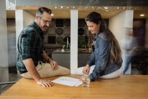 “Concerned Canadian couple reviewing mortgage renewal documents at home in 2025”
