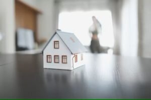 Wildfire-damaged home after natural disaster, highlighting climate risk for mortgages