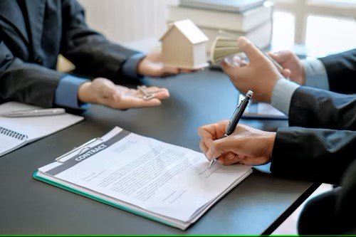 A person reviewing mortgage documents with a pen, representing renewal-focused strategies and broker-driven client interactions in Canada.