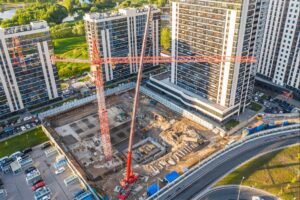 Rental housing construction site with CMHC branding visible