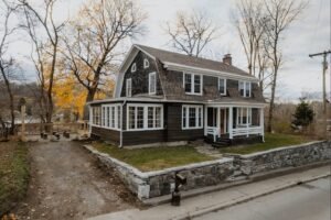 Foreclosed house in Canada with a warning sign on the lawn and a vacant look
