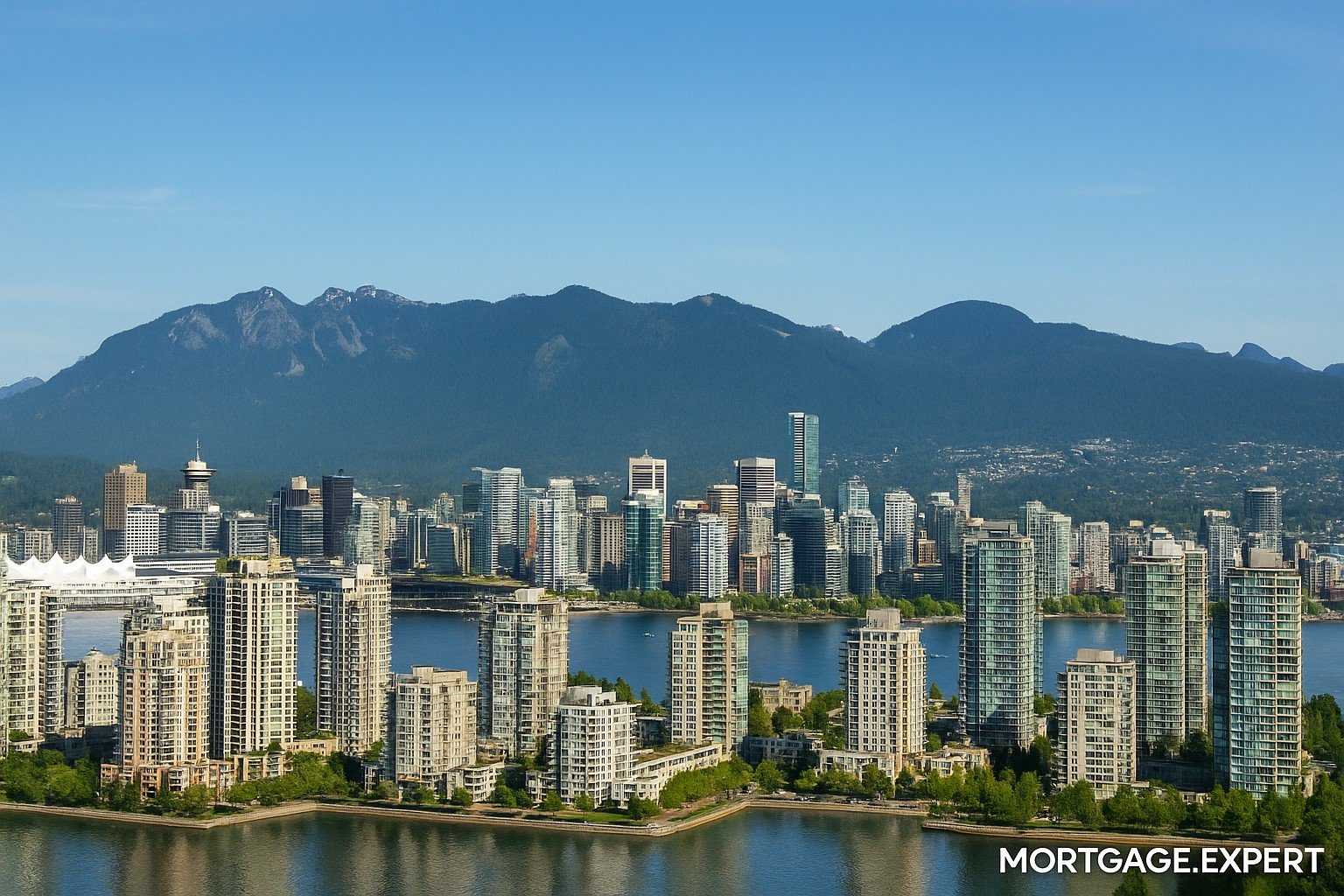Vancouver skyline with residential towers, mountains, and Burrard Inlet on a clear summer day
